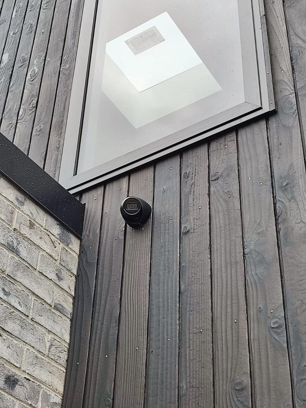 Camera mounted on timber cladding
