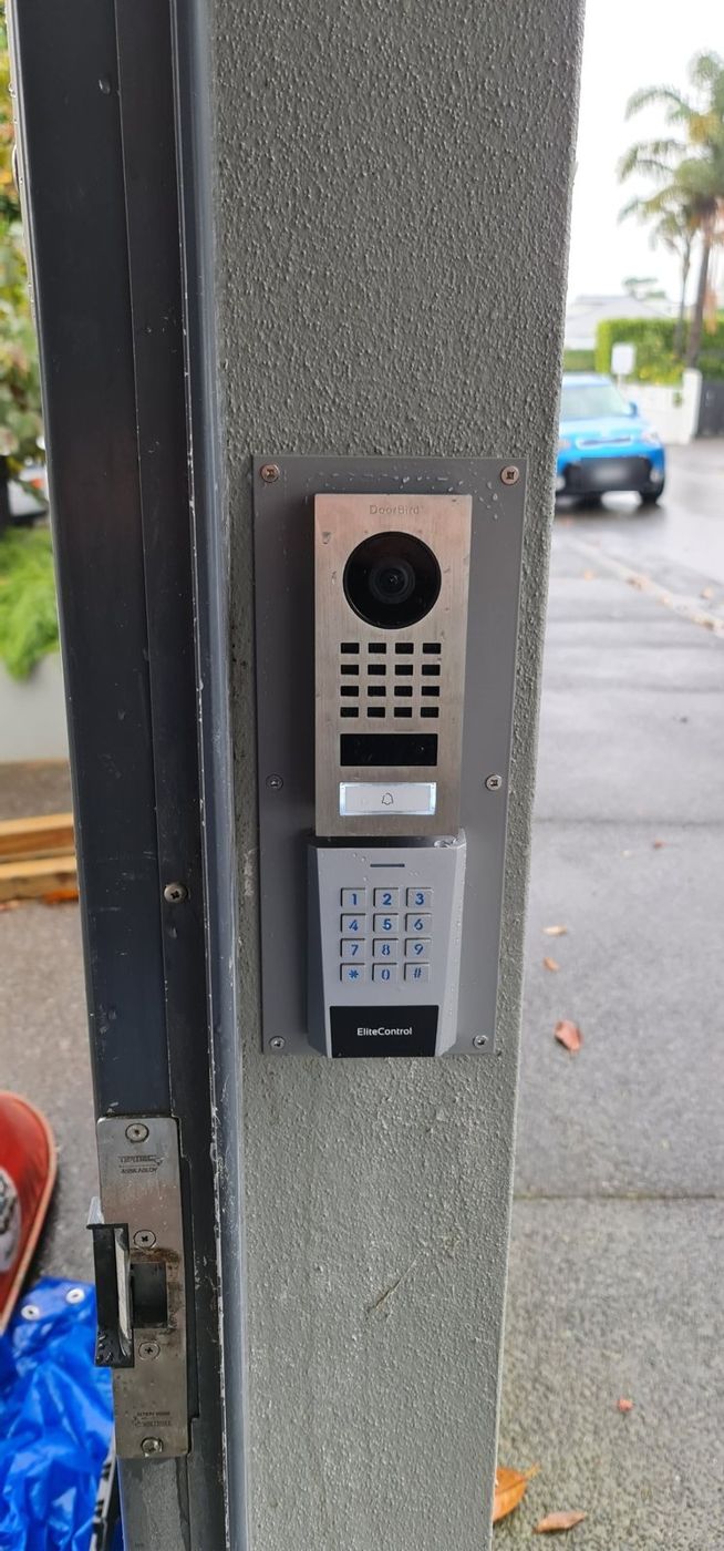After: Fabricated a new mounting panel for the intercom and keypad to mount to. powder coated to match the wall colour.